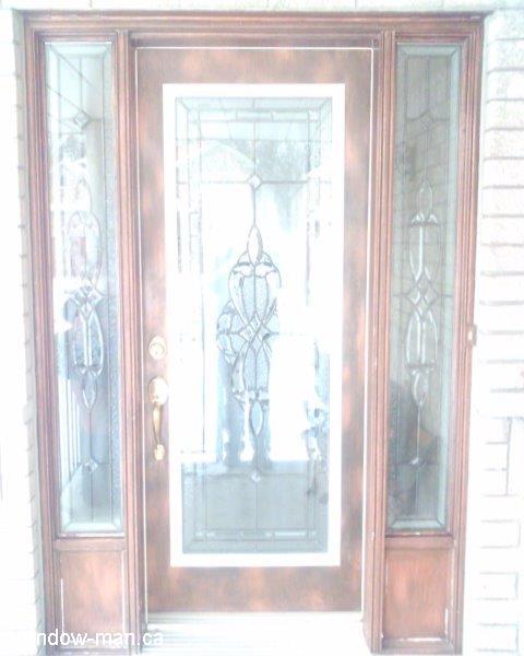 Custom stained glass inserts in existing front door. Beveled Glass with patina caming